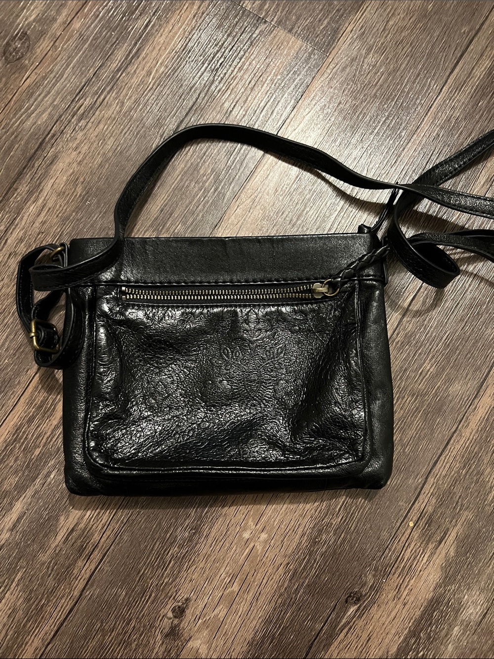 The Sak Black Leather Crossbody with Front Zip and Embossed Detail